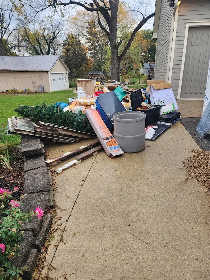 Dumpster being loaded with debris for 3 Yard Dumpster Rental in Silver Springs